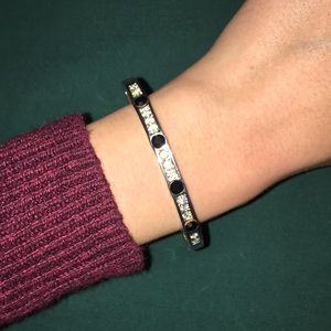 Silver bracelet with black and clear accents